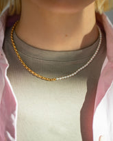 Half Short Loop Chain & White Seed Pearl Necklace on model.