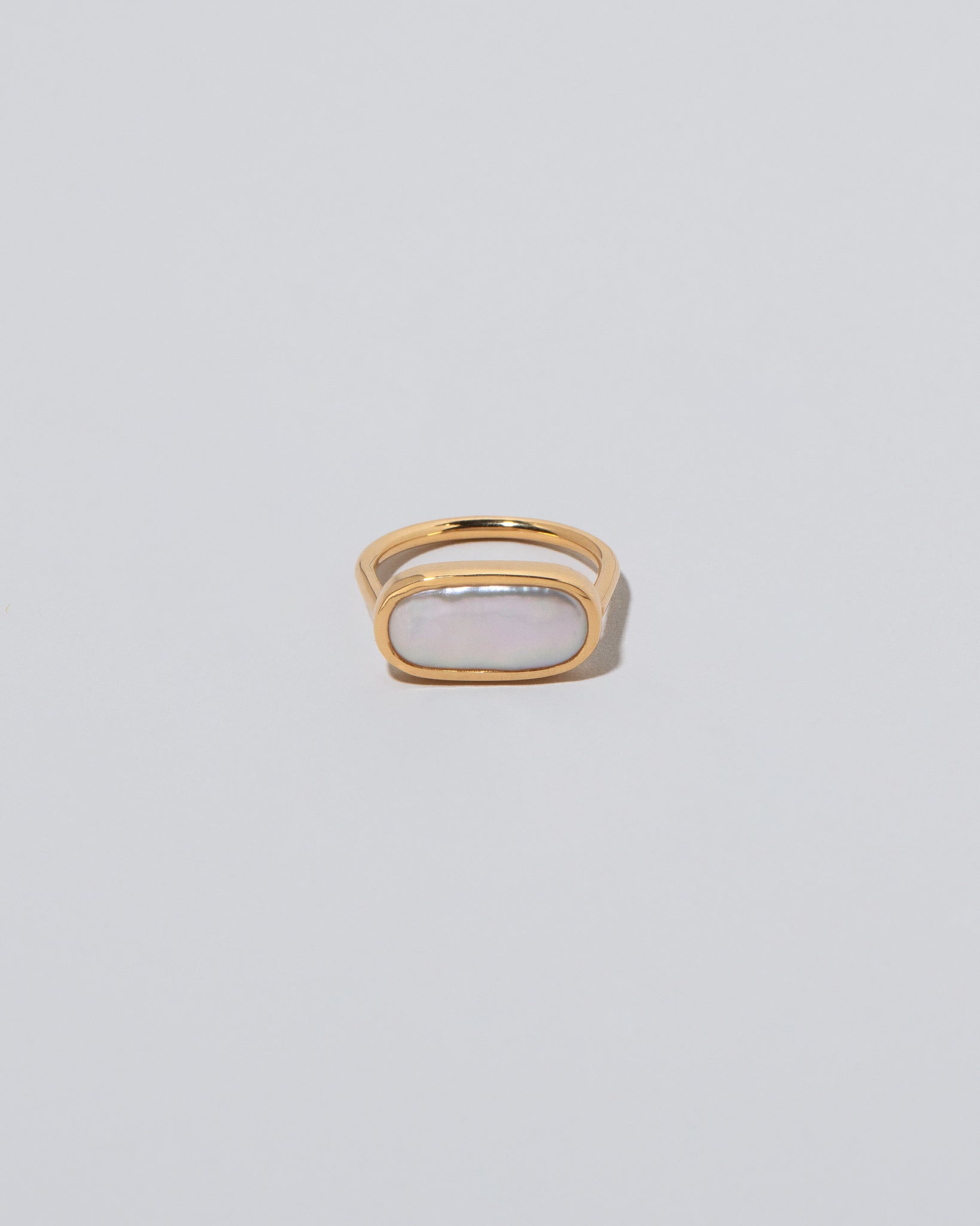 18k Gold Anhinga Pearl Ring on light color background.