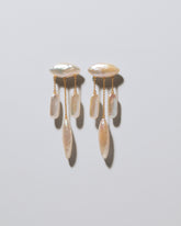 Egret Pearl Earrings on light color background.