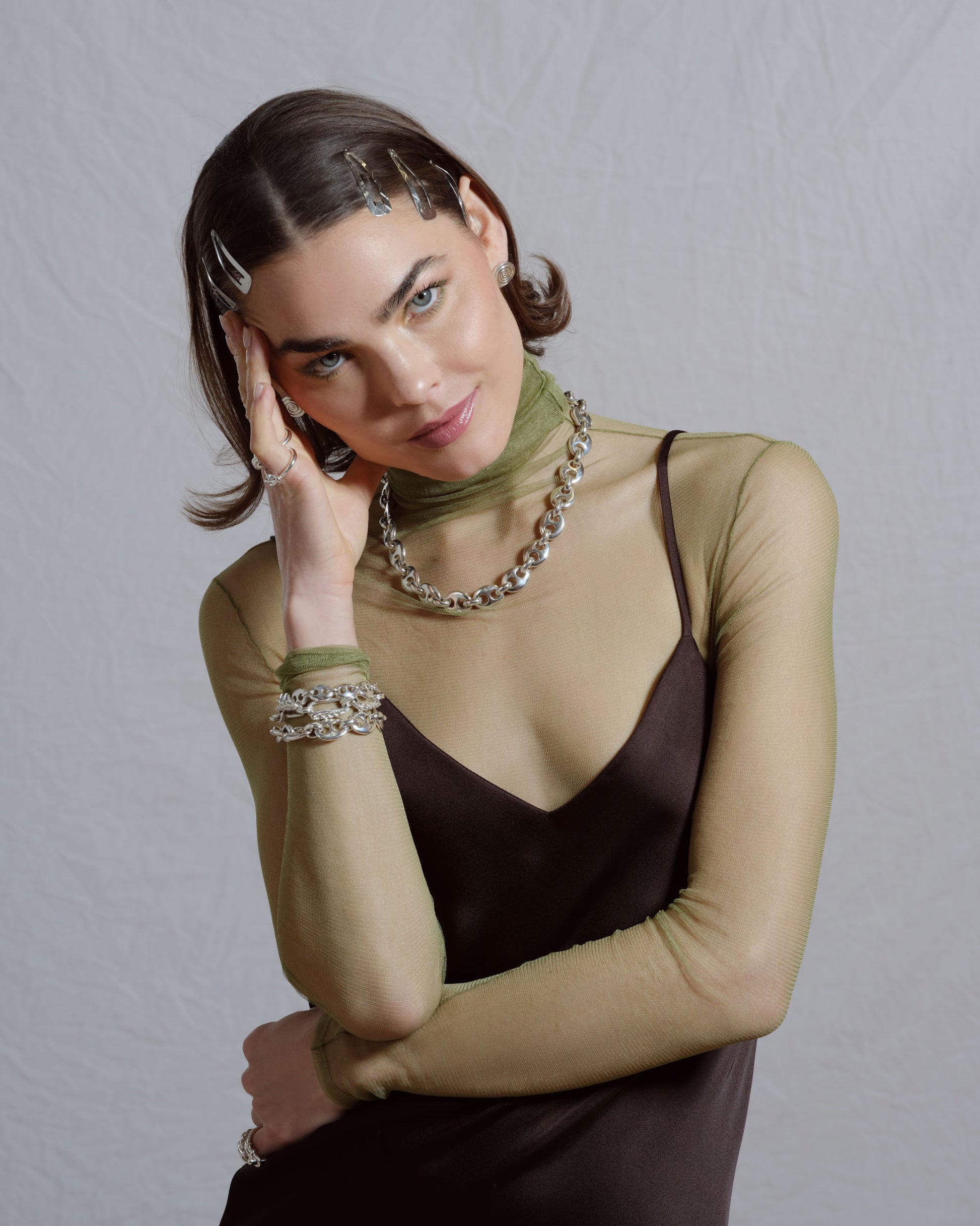 Styled image featuring CRZM jewelry on model.