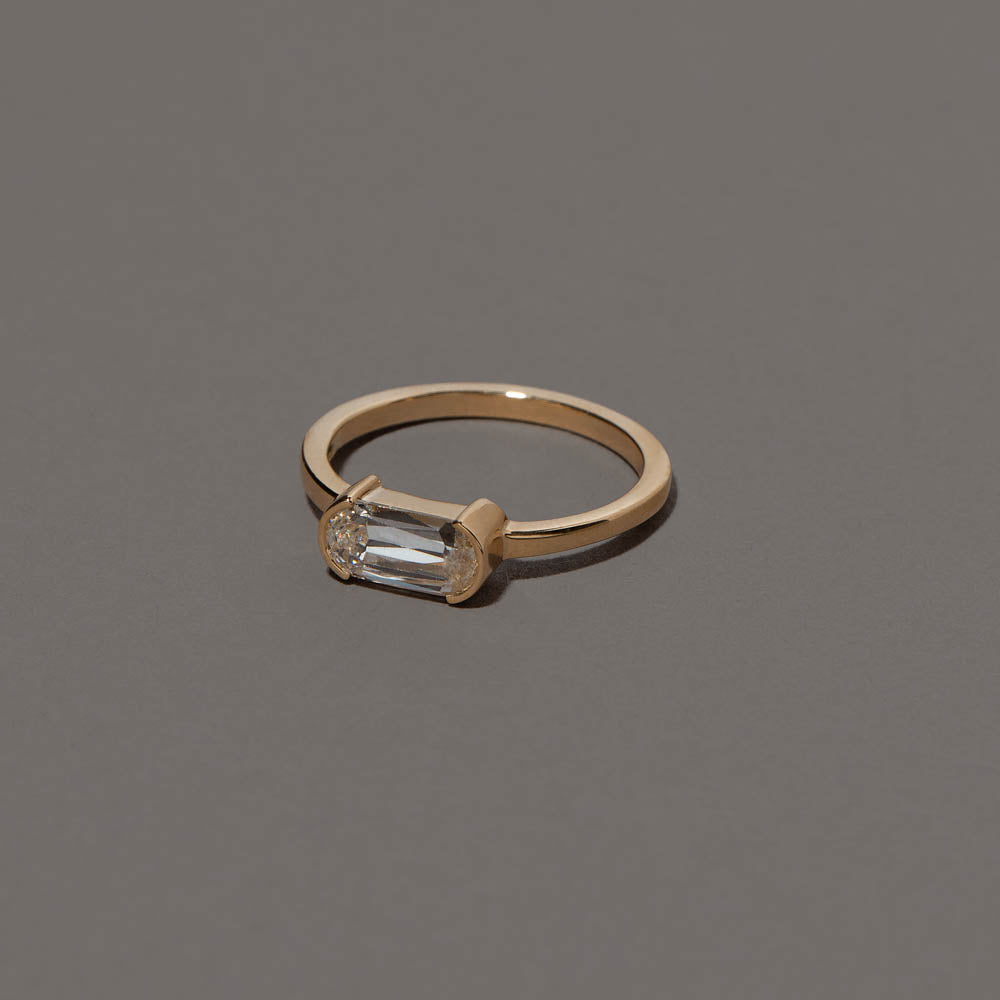 product_details::Closeup details of the Conviviality Ring on grey color background.
