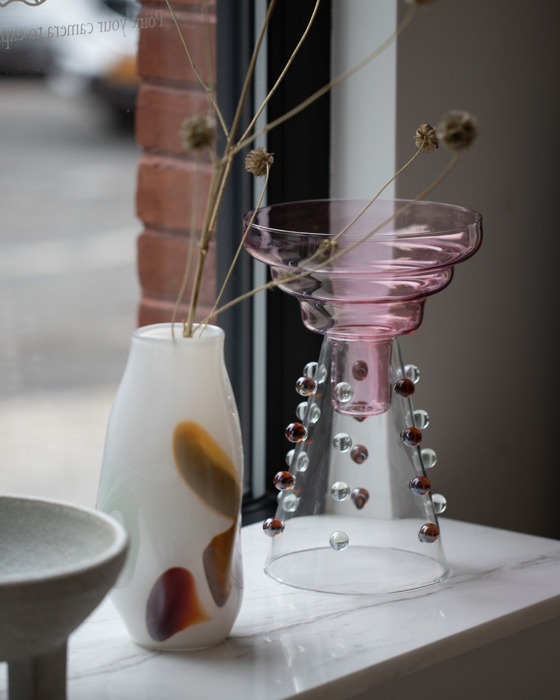 Styled image featuring BaleFire Glass Small White Epiphany Vase.