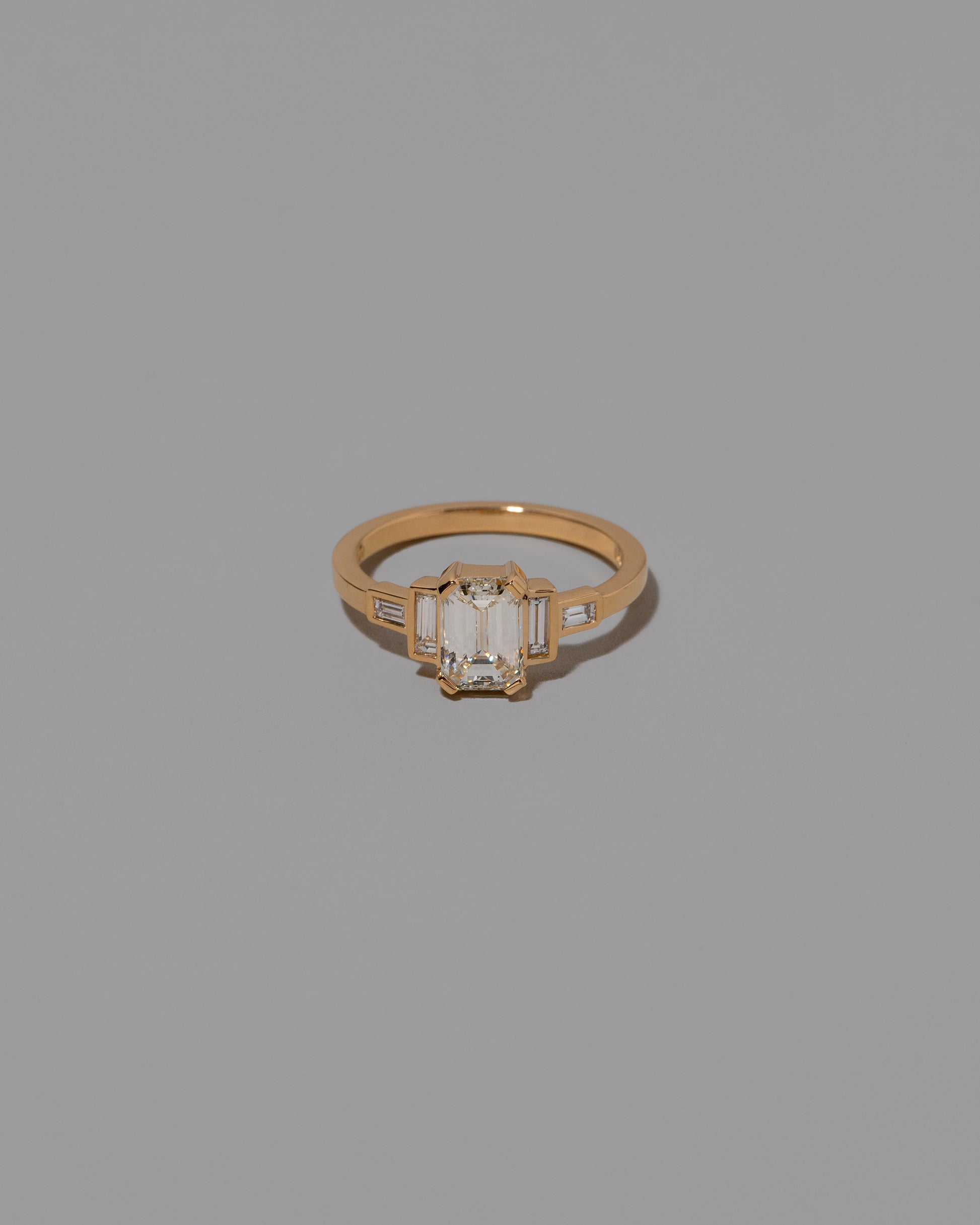 Diamond Assertion Ring on light color background.