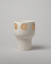 Stephanie Phillips One Rattan Vessel on light color background.