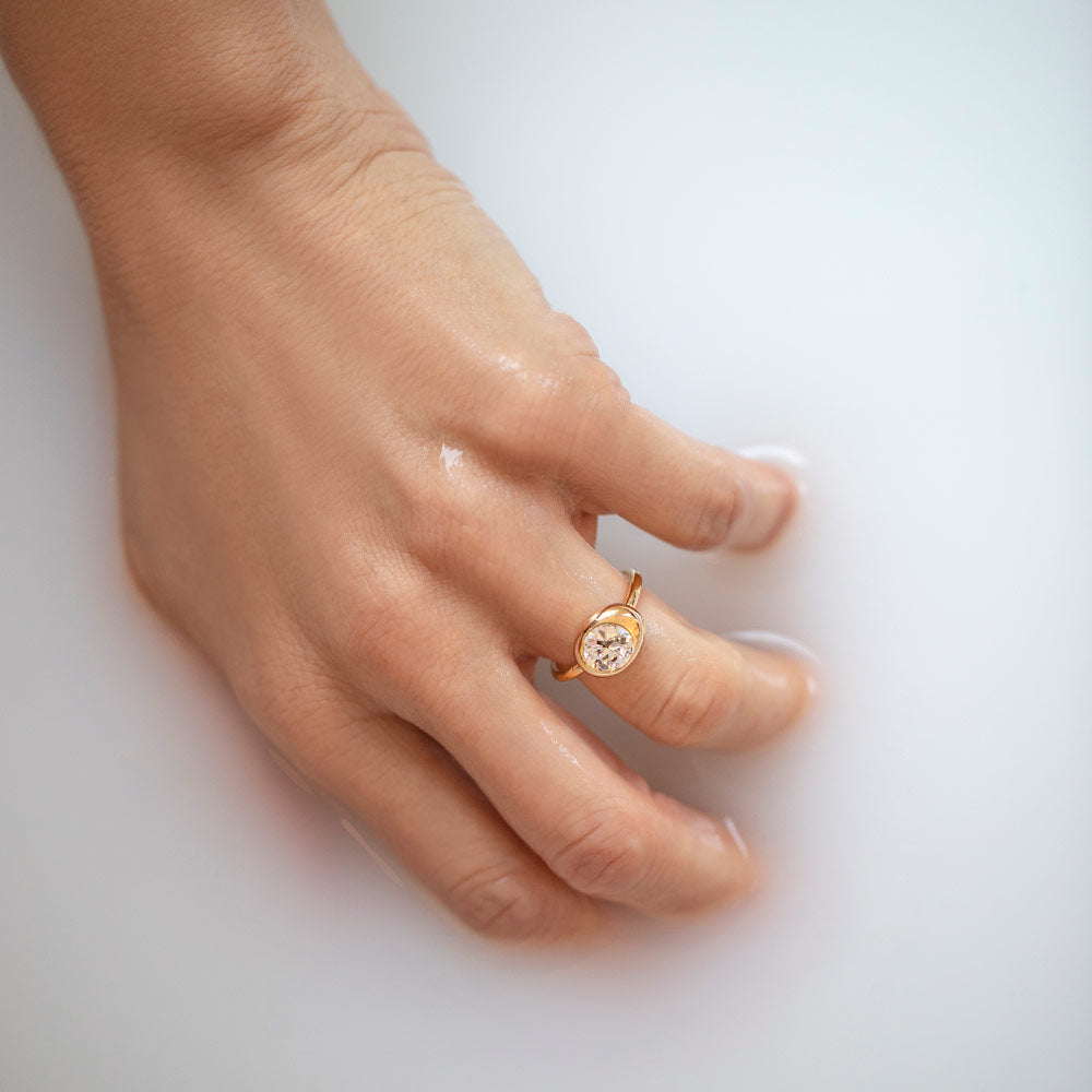 product_details::White Diamond Grand Level Ring on model.