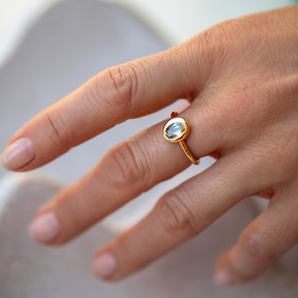 product_details::Oval Bicolor Sapphire Precise Ring on model.