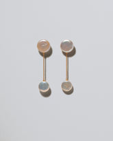 Plover Pearl Earrings on light color background.