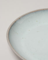 Closeup details of the Humble Ceramics Shallow Stillness Bowl on light color background.