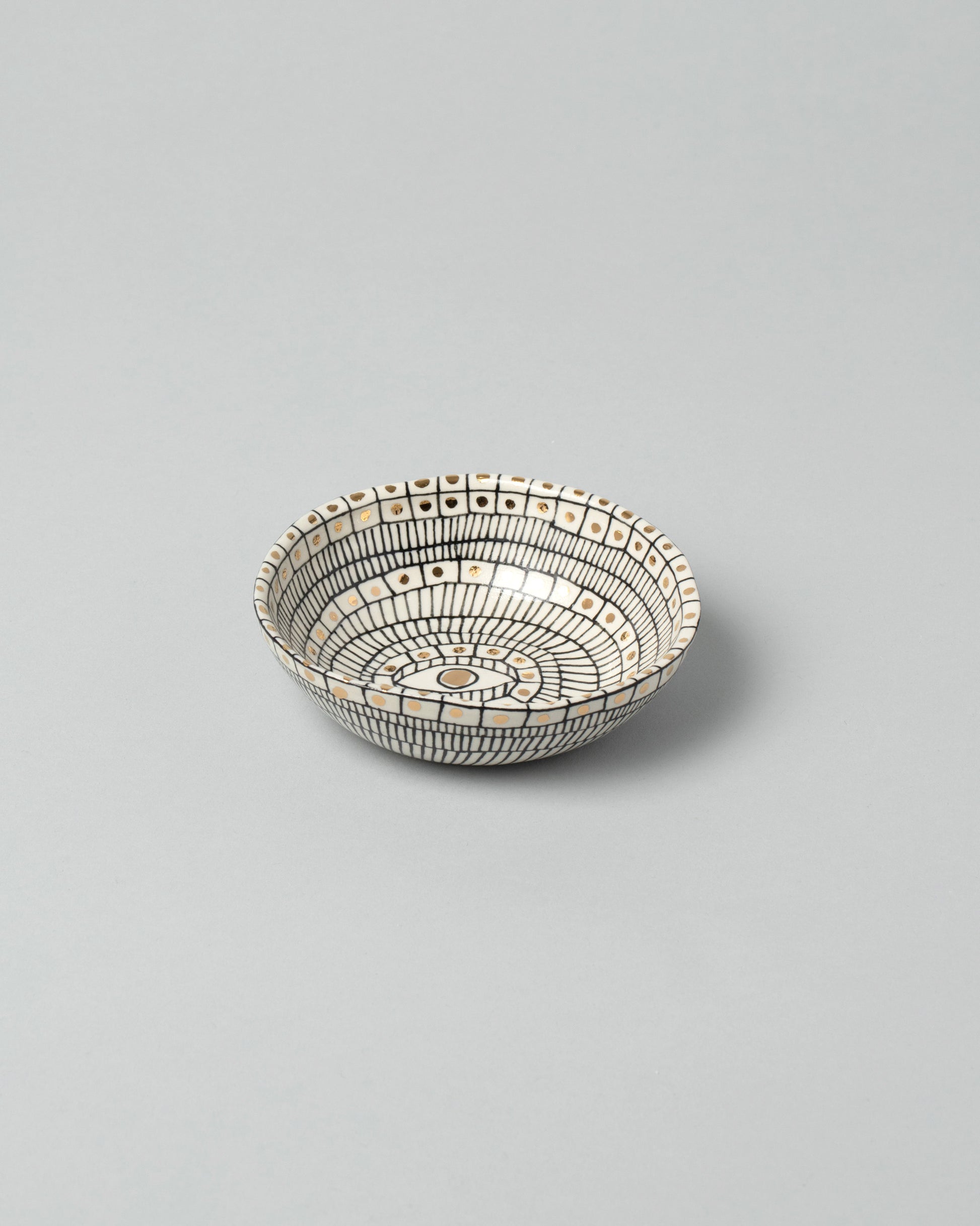 Suzanne Sullivan Five Small Bowl on light color background.