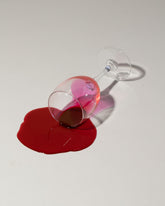 Closeup detail of the Spills Red Wine Spill on light color background.