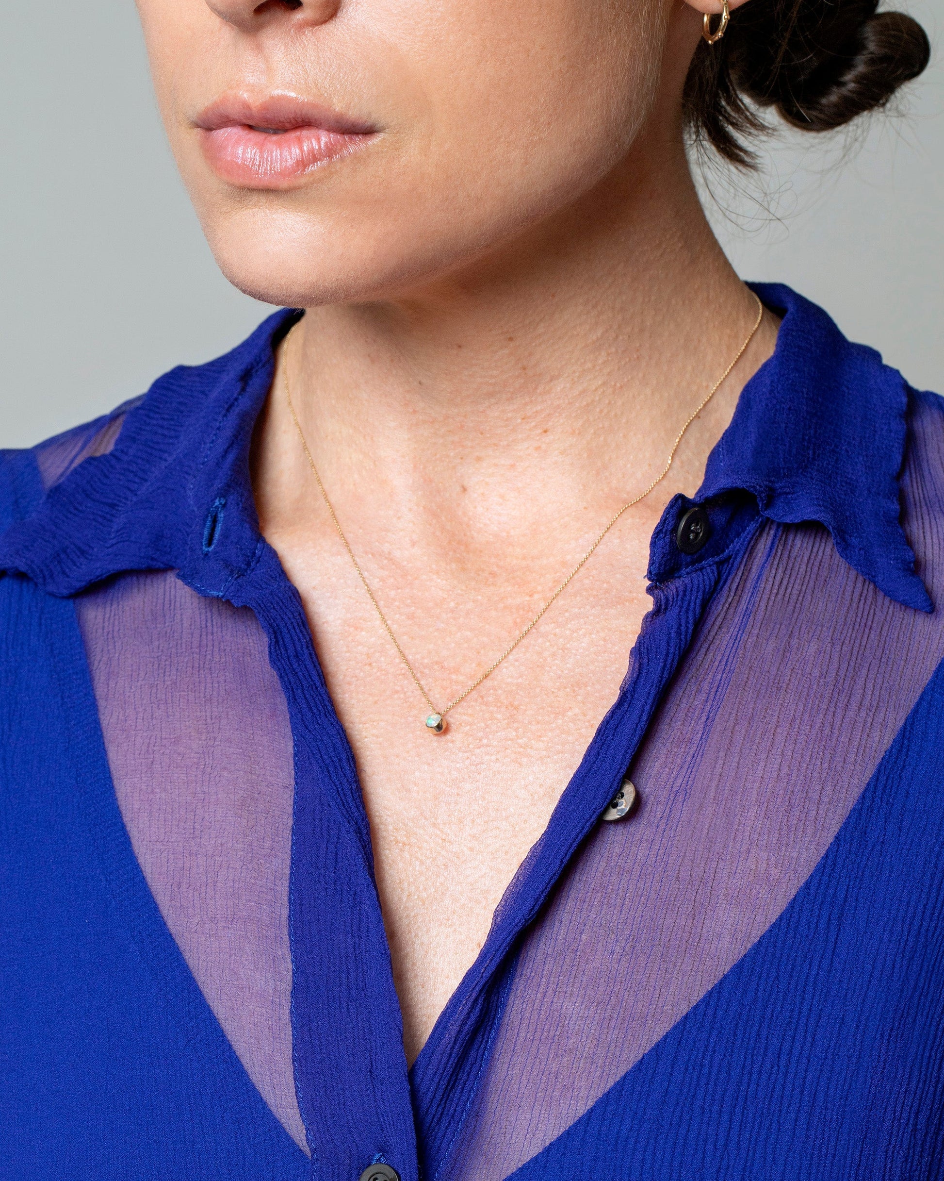 Opal Birthstone Necklace on model.