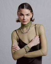 Styled image featuring CRZM jewelry on model.