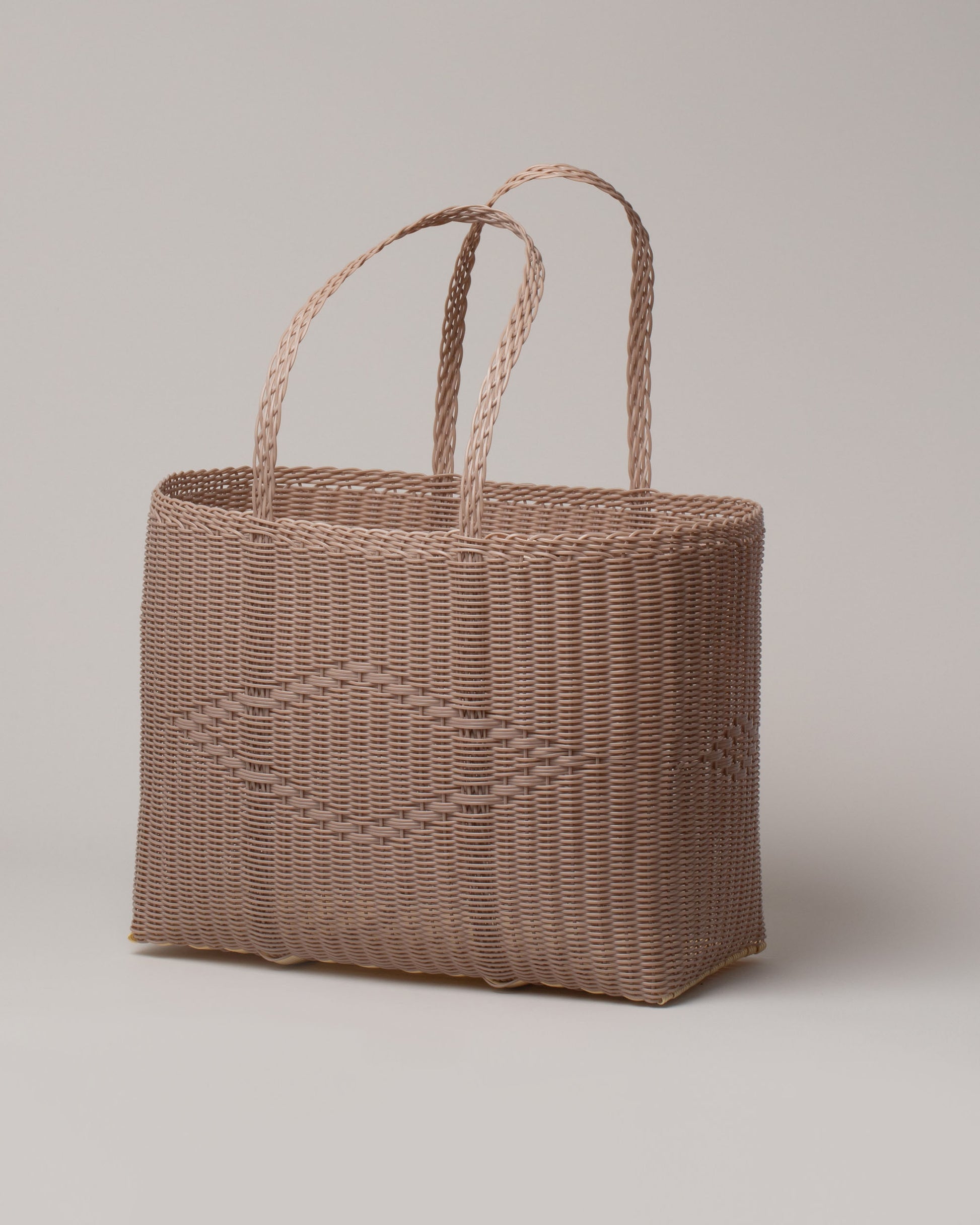 Palorosa Powder Large Handwoven Tote Basket Bag on light color background.