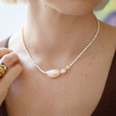 product_details::Nereus Pearl Necklace on model.