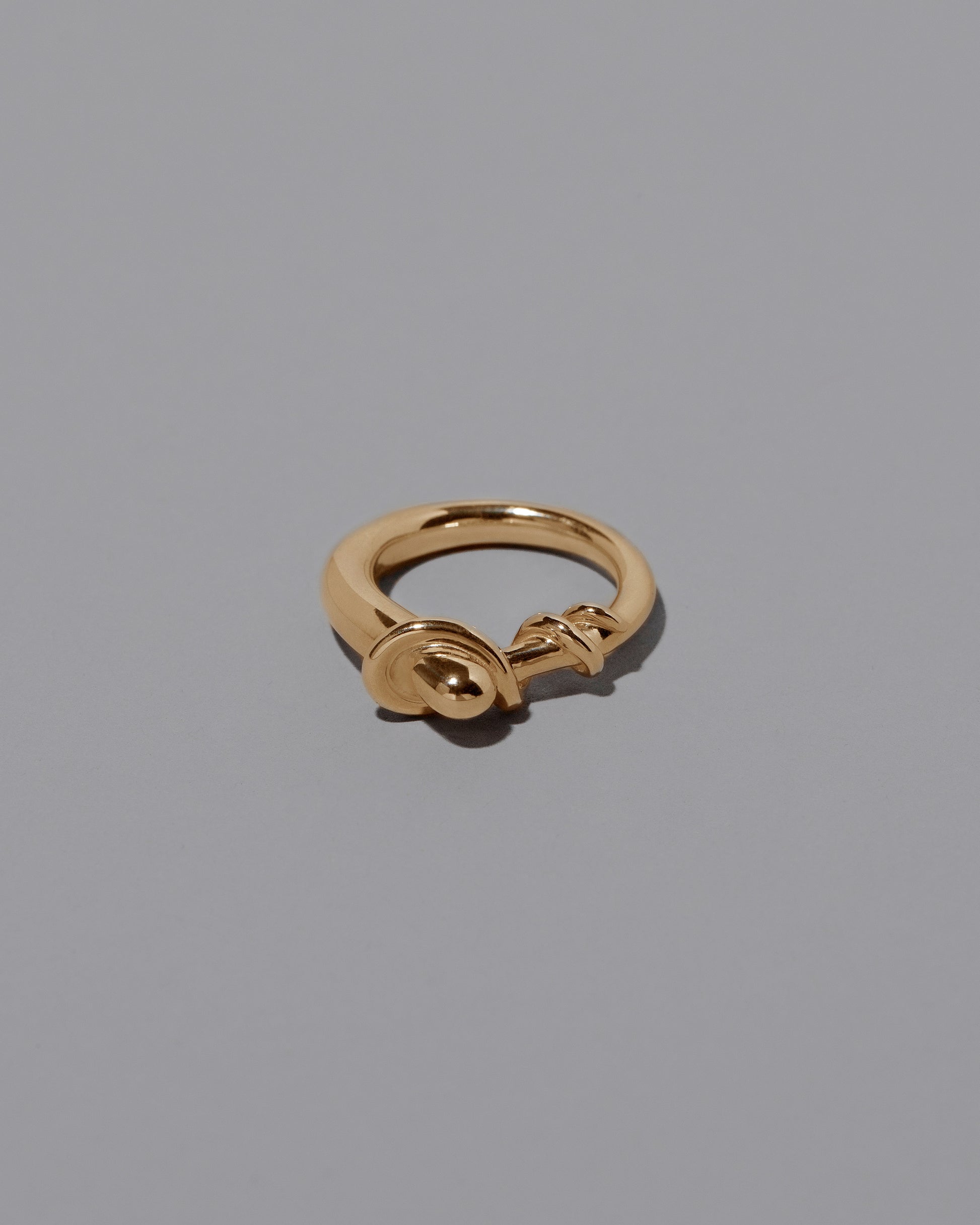 CRZM 22k Gold Terrane Ring on light color background.