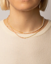 Half Oval Chain & White Seed Pearl Necklace and Half Oval Chain & Peony Seed Pearl Necklace on model.