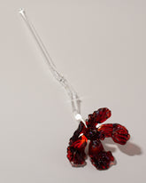 Alex Rosenbaum Red Glass Flower on light color background.
