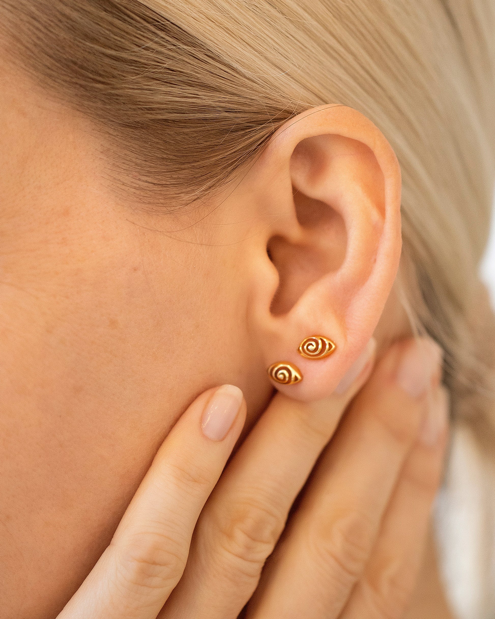 Gold Altered State Stud Earrings on model.