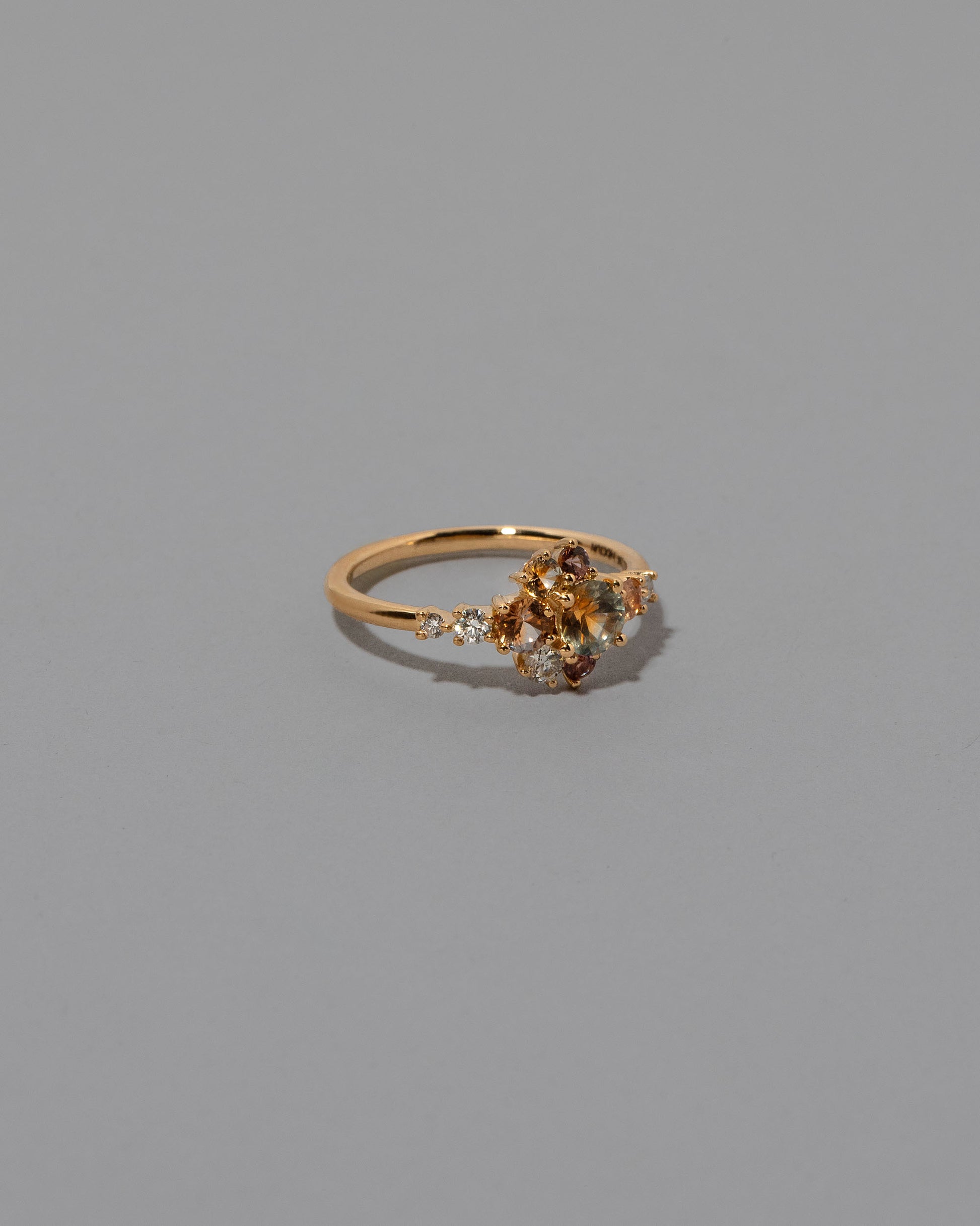 View from the side of the Sapphire Anthea Ring on light color background.