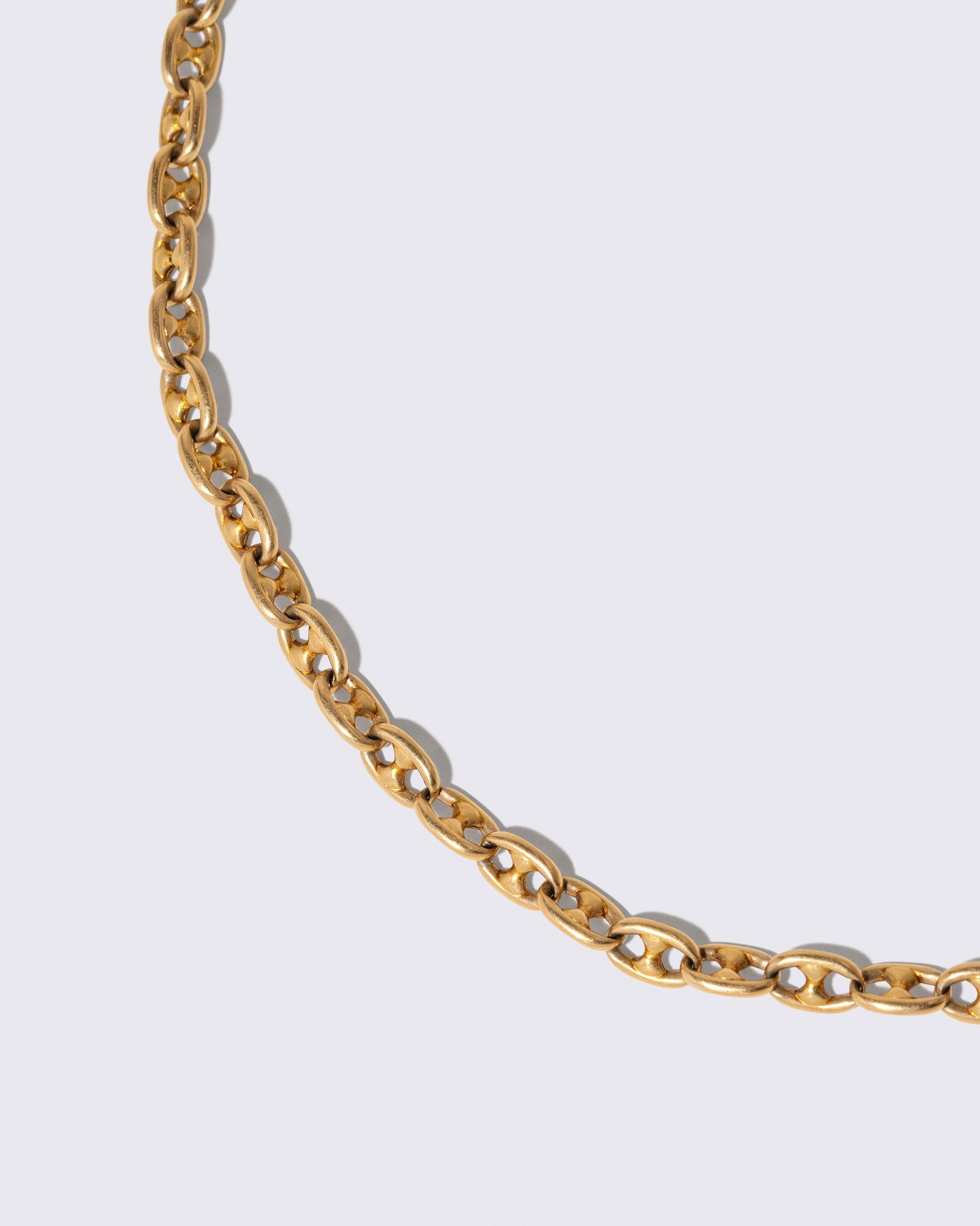 Closeup details of the Vintage Mixed Link Chain Necklace on light color background.