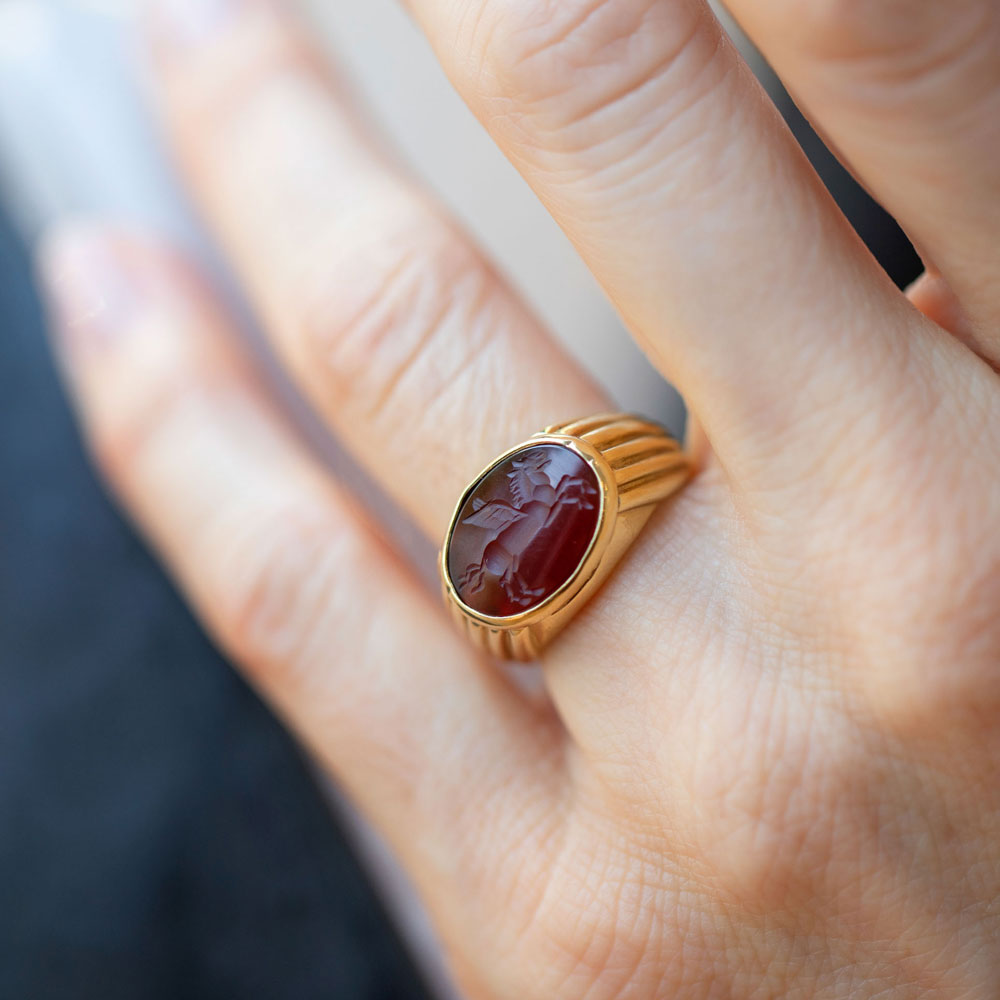 product_details::Vintage Bvlgari Carnelian Pegasus Intaglio Ring on model.