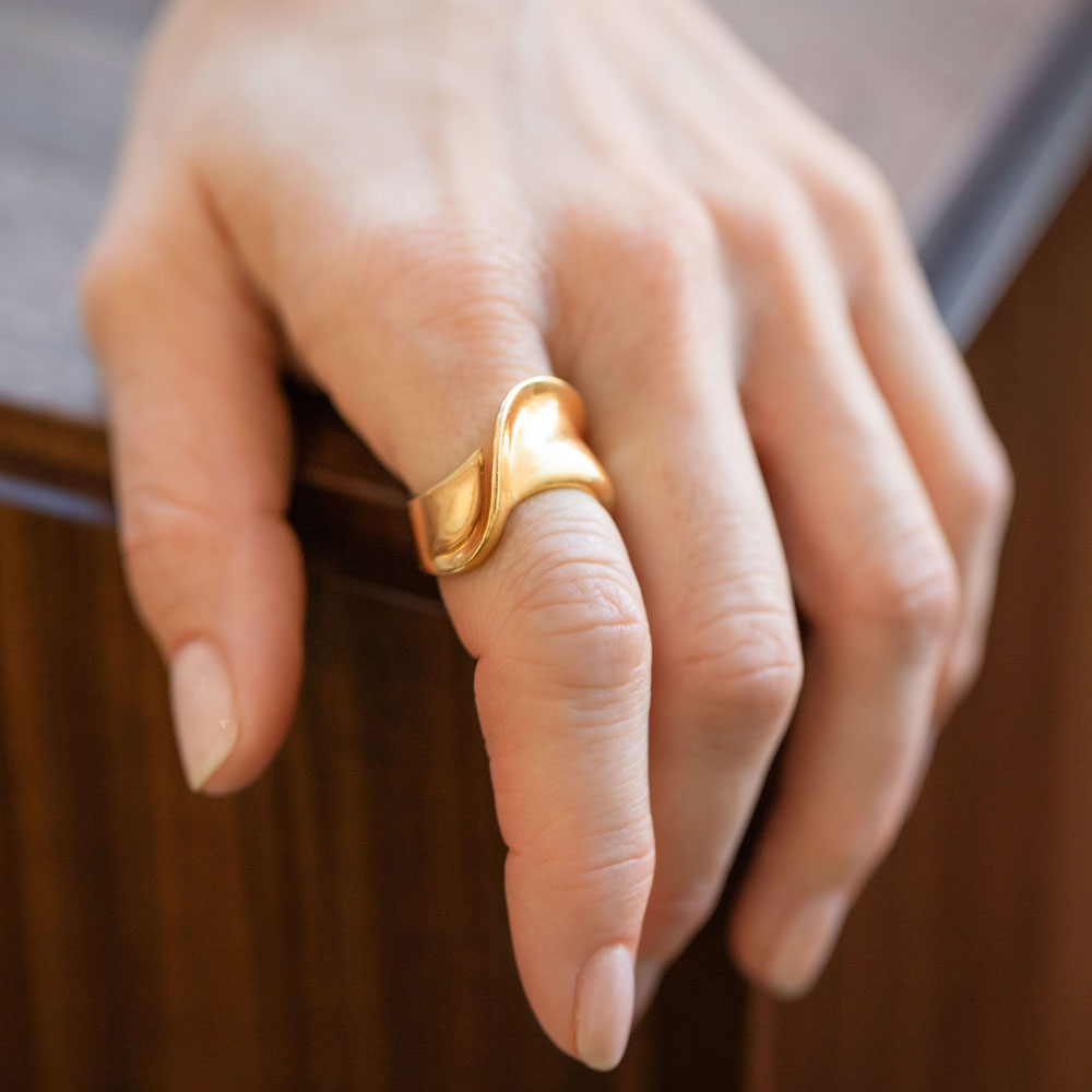 product_details::Vintage Gold Ribbon Ring on model.