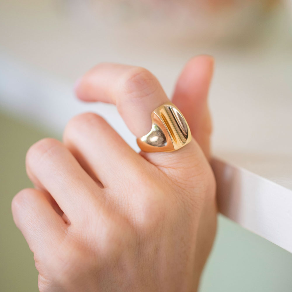 product_details::Vintage Gold Saddle Ring on model.