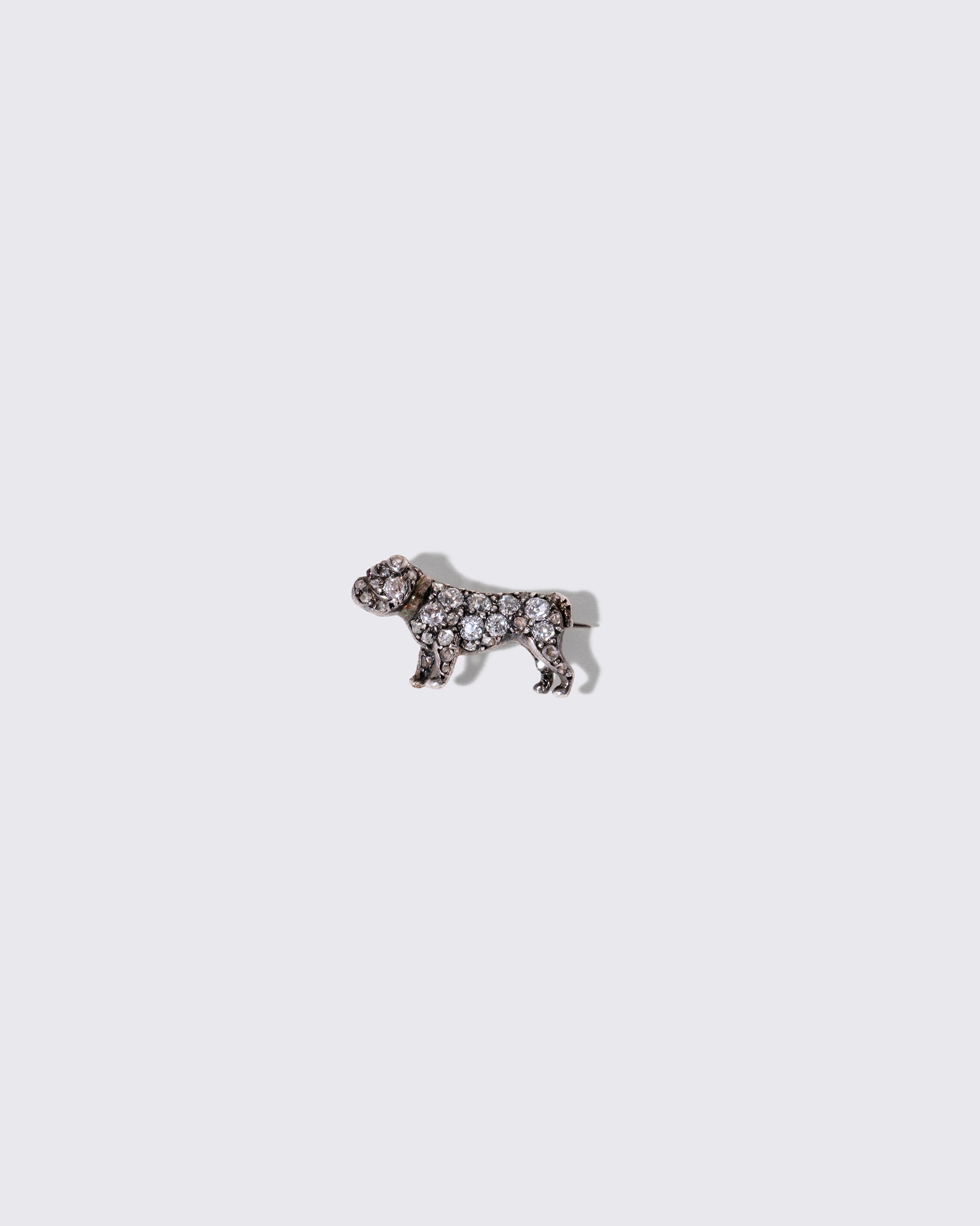 Antique Diamond & Ruby-Eyed English Bulldog Brooch on light color background.