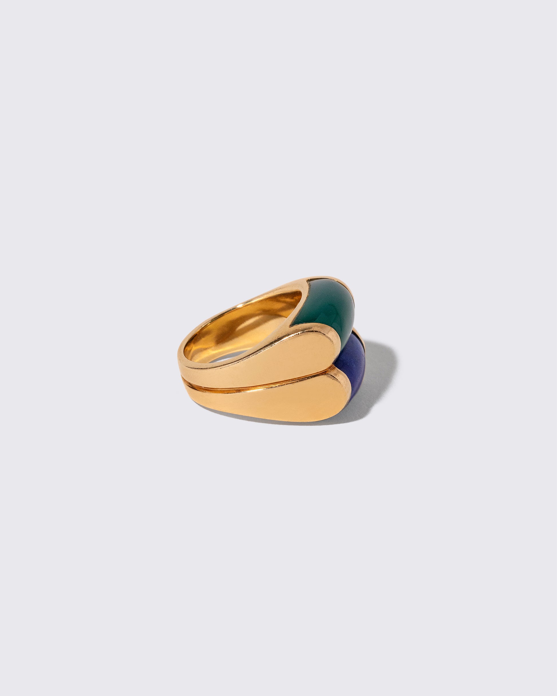 Detail view of the Vintage Bvlgari Doppio Tronchetto Lapis & Chalcedony Ring on light color background.