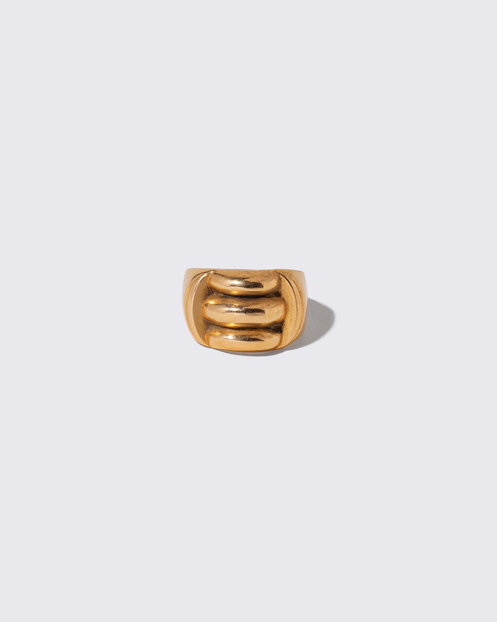 Vintage Gold Gadroon Ring on light color background.