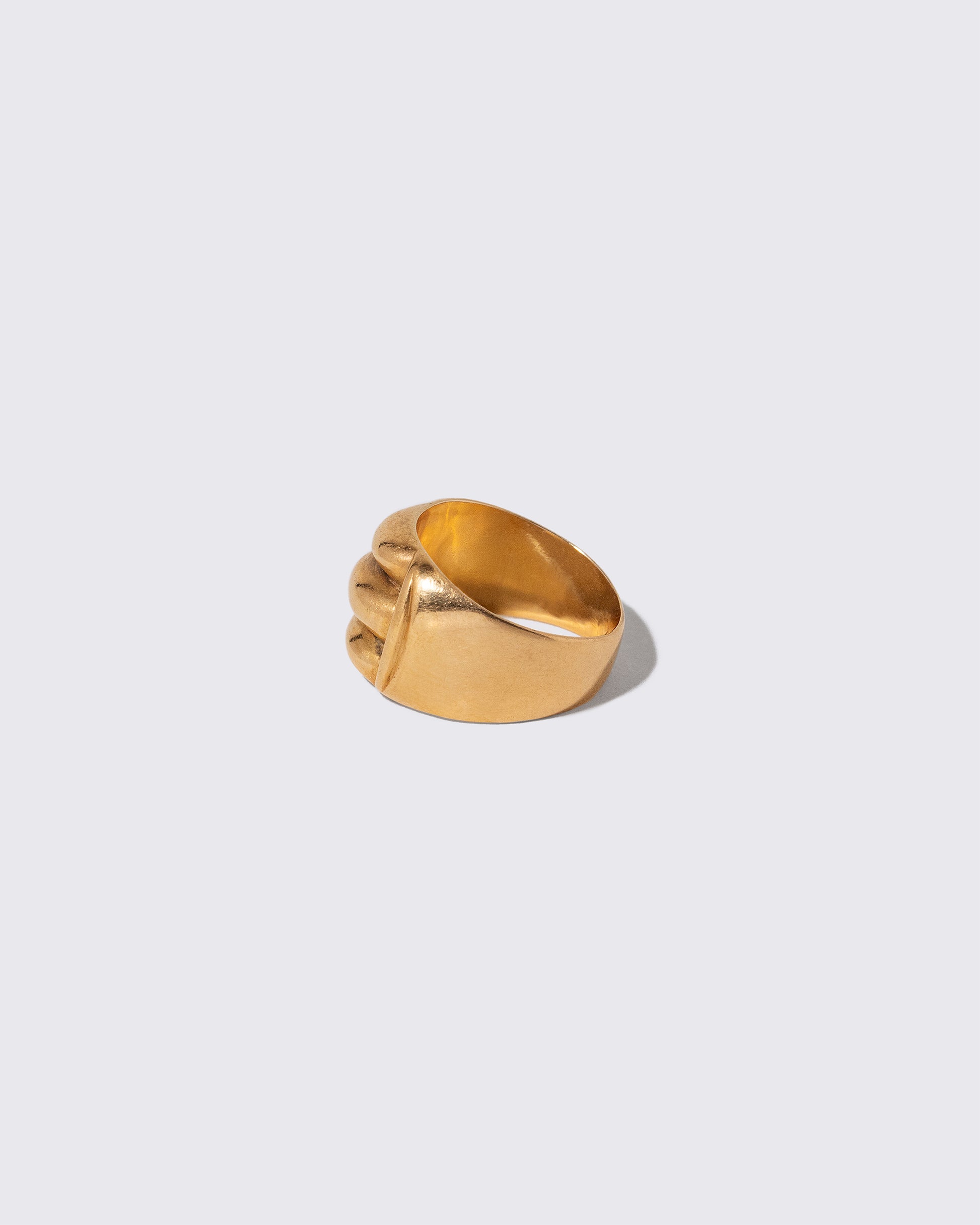 Detail view of the Vintage Gold Gadroon Ring on light color background.