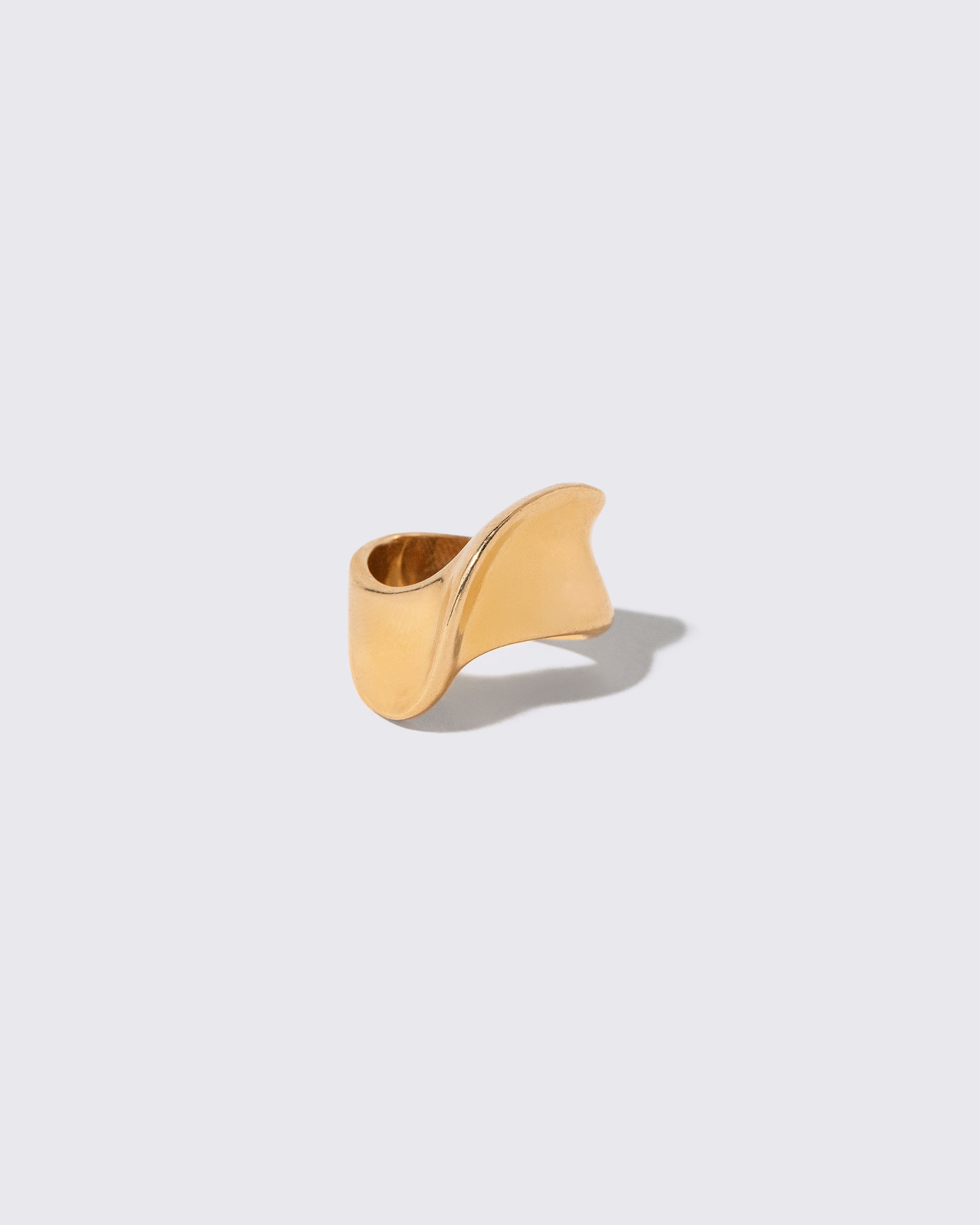 Vintage Gold Ribbon Ring on light color background.