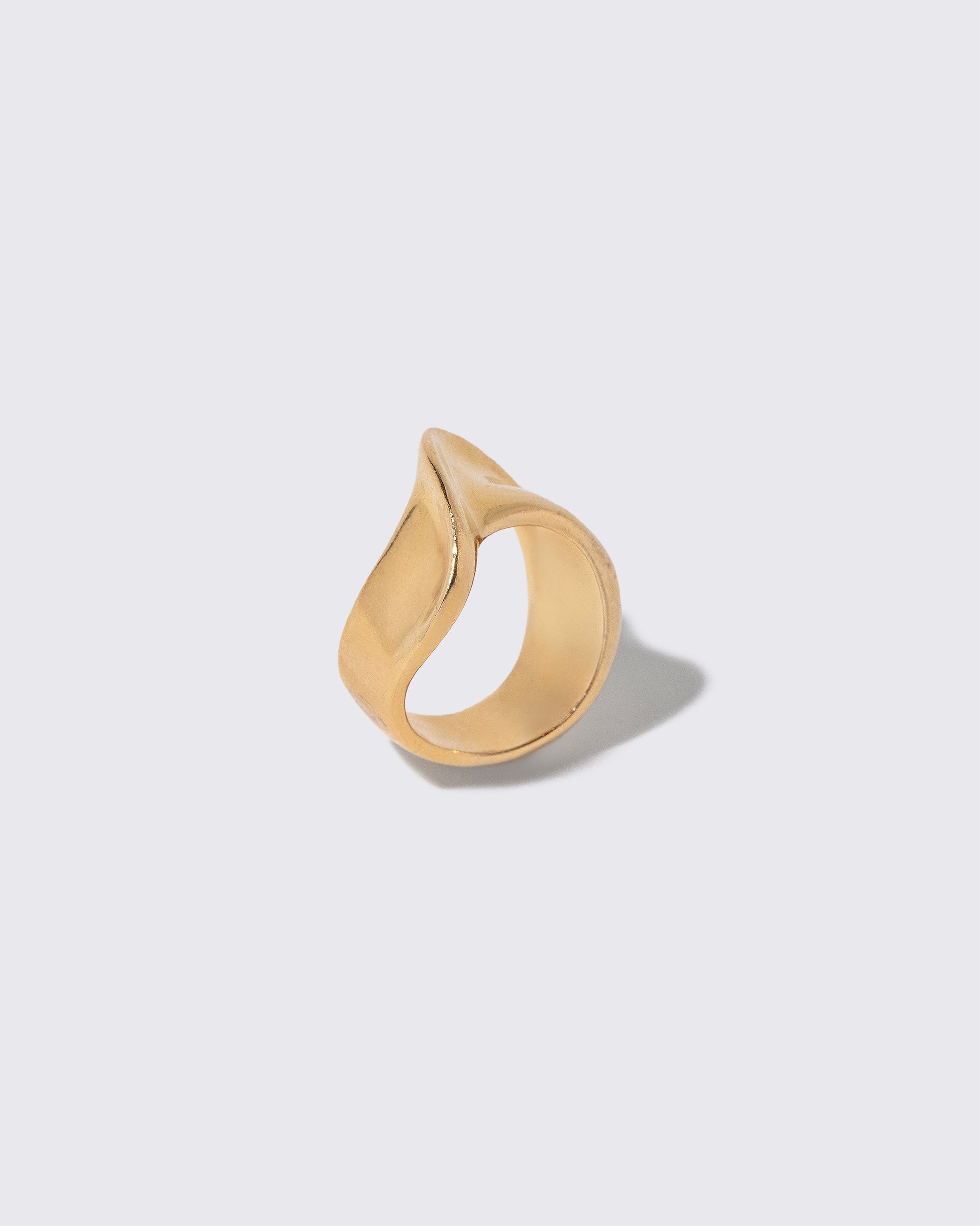 Detail view of the Vintage Gold Ribbon Ring on light color background.