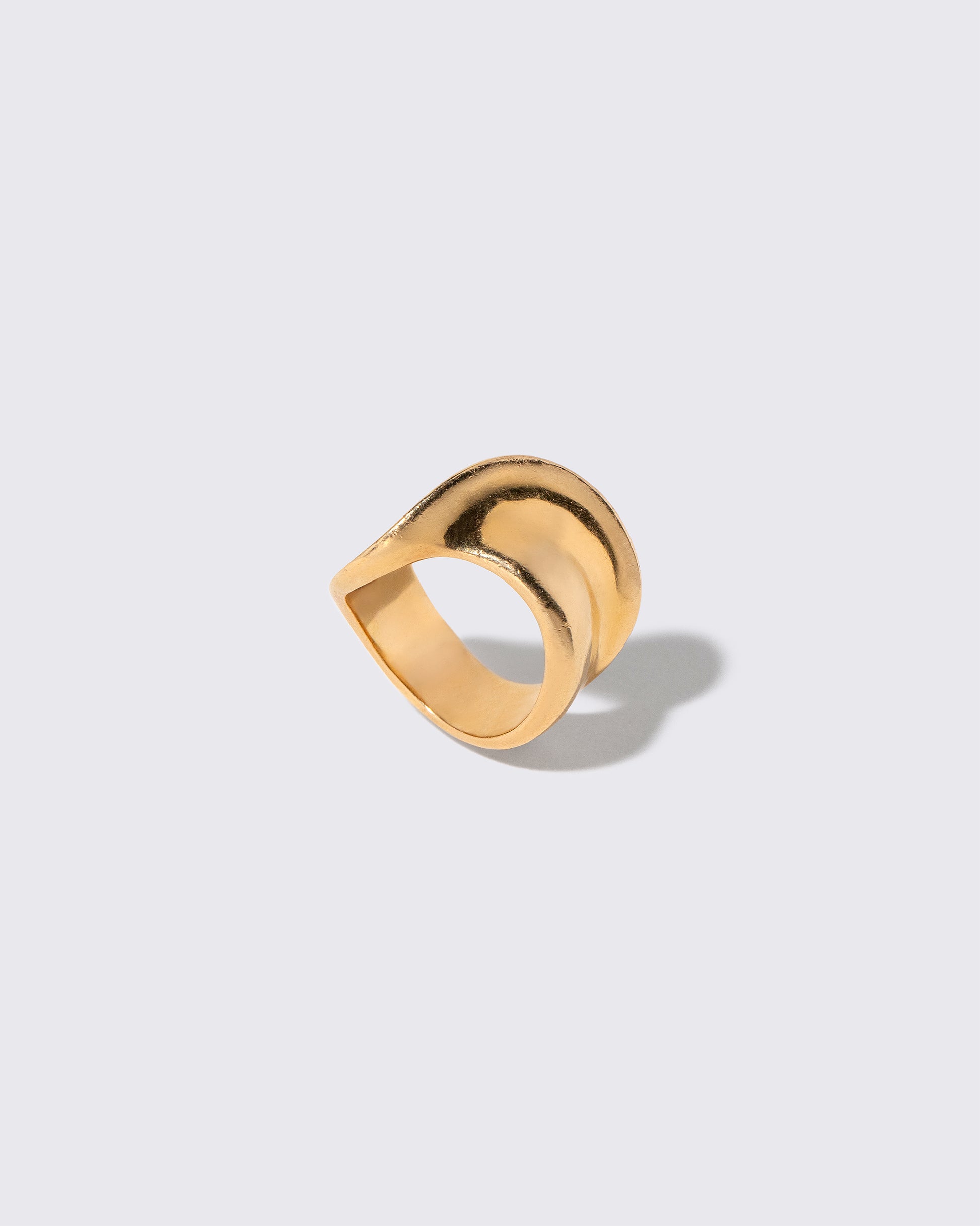 Detail view of the Vintage Gold Ribbon Ring on light color background.