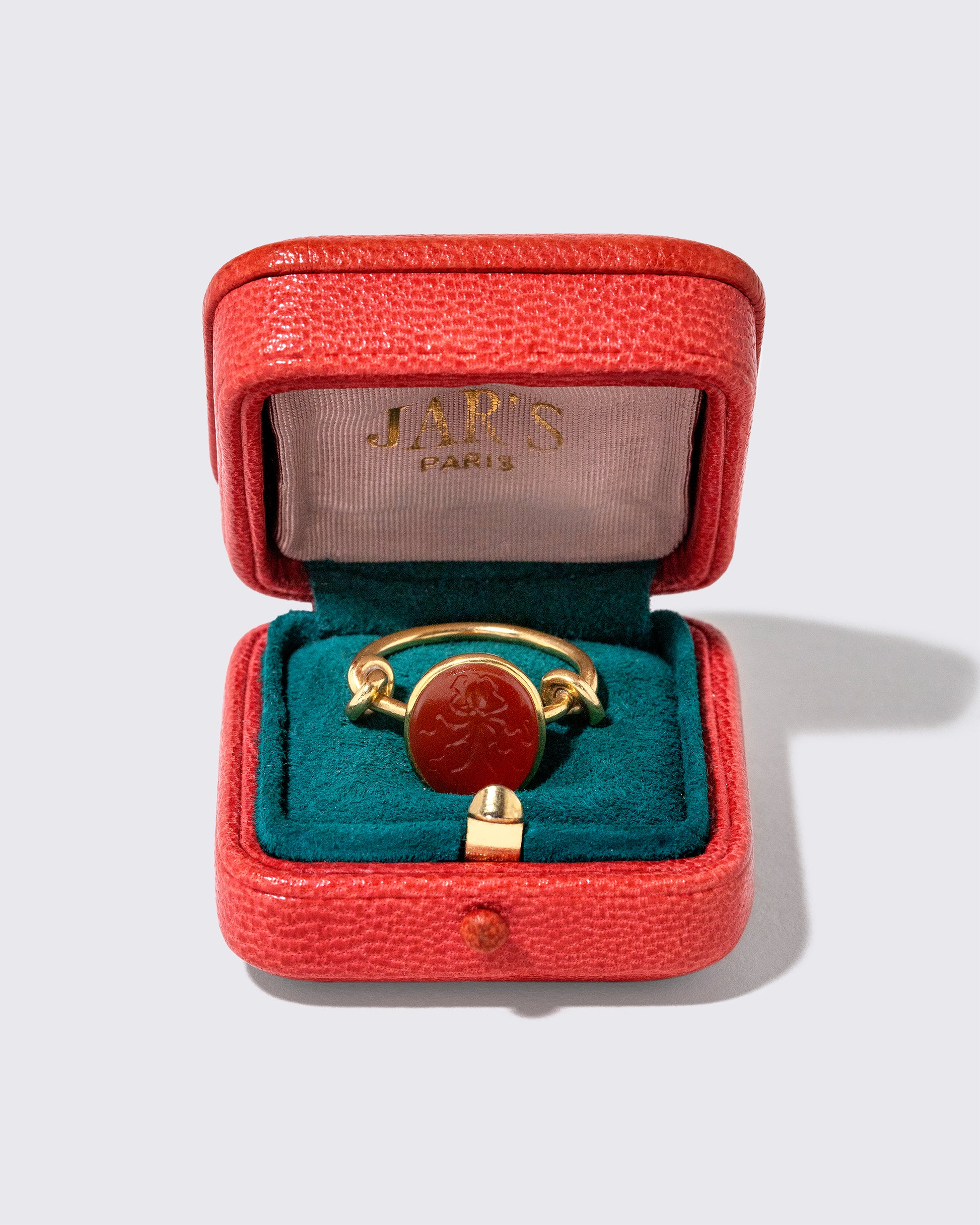 Inside view of the Vintage JAR Carnelian Ring With Box on light color background.