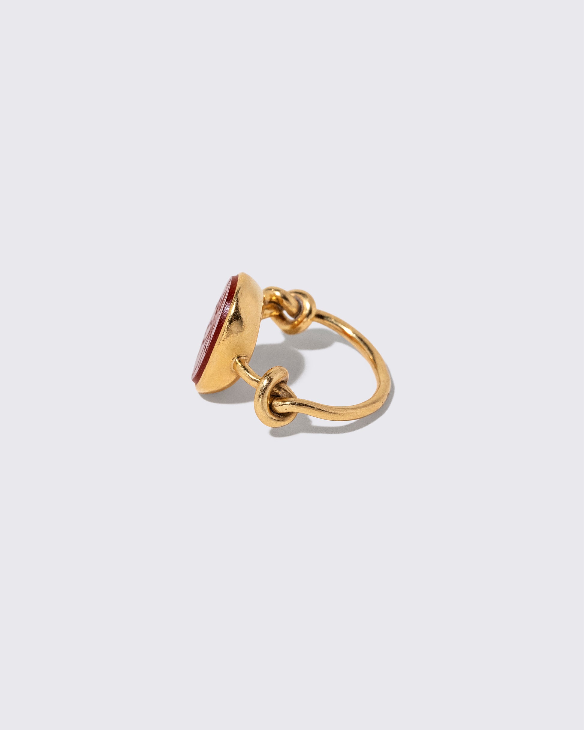 Detail view of the Vintage JAR Carnelian Ring on light color background.