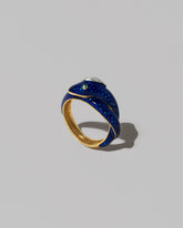 Vintage Cartier Enamel Snake Ring on light color background.