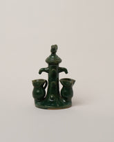 Apotropaia Bird Fountain Sculpture on light color background.