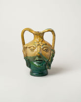 Apotropaia Head Handled Vessel on light color background.