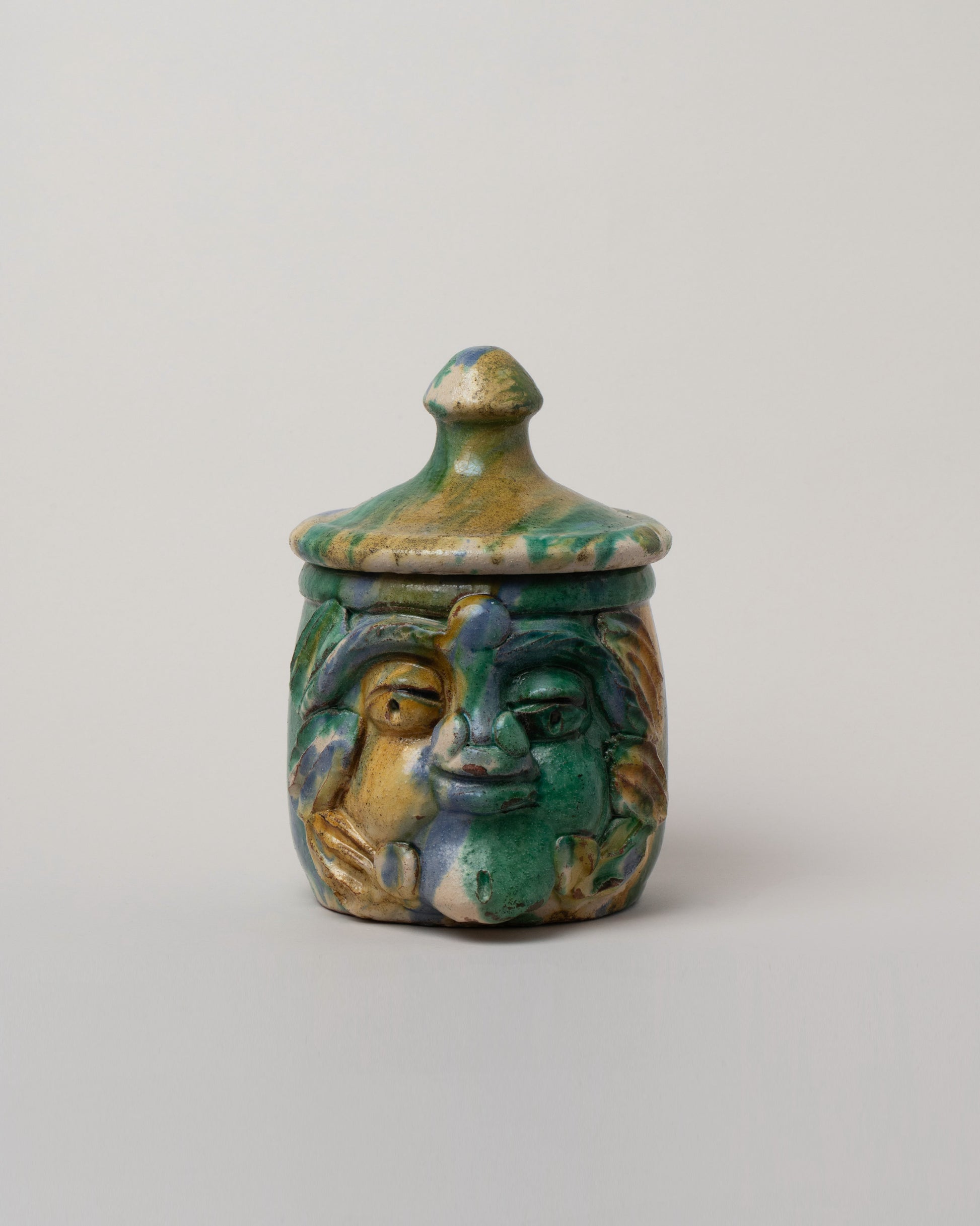Apotropaia Small Head Jar on light color background.