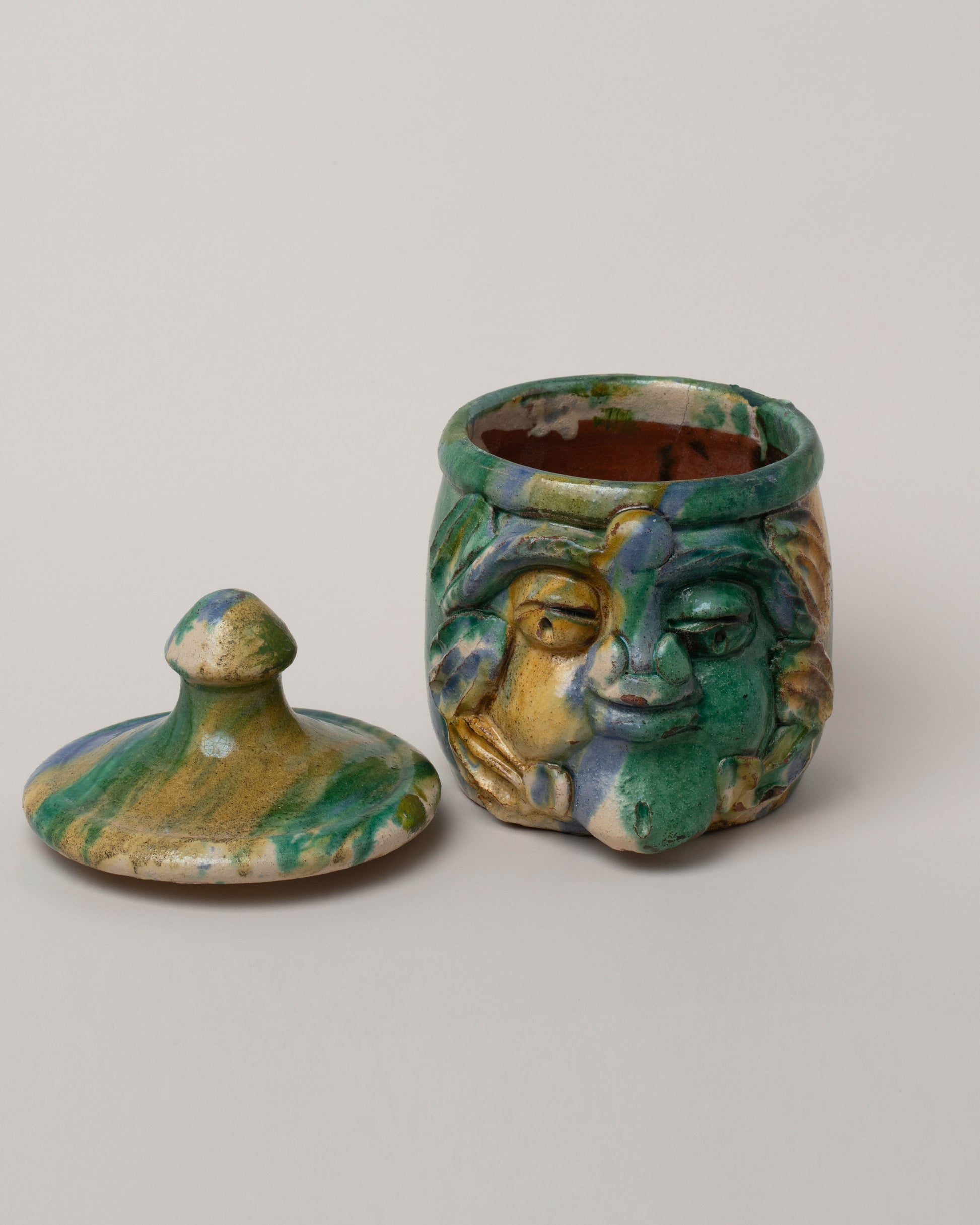 Detail view of the Apotropaia Small Head Jar on light color background.