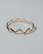 Samples & Imperfects Yellow Gold Medium Cut-Outs Bracelet on light color background.