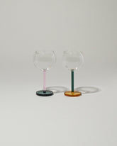 Sophie Lou Jacobsen Golden Hour: Pink & Evergreen + Evergreen & Honey Bilboquet Wine Glass Set on light color background.