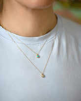 Diamond Birthstone Level Necklace and Turquoise Cabochon Birthstone Level Necklace on model.