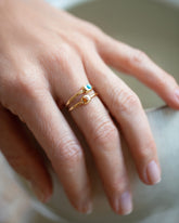 Citrine Birthstone Level Ring and Turquoise Cabochon Birthstone Level Rings on model.