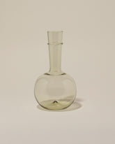 Bollenglass Design Green Bud Vase on light color background.