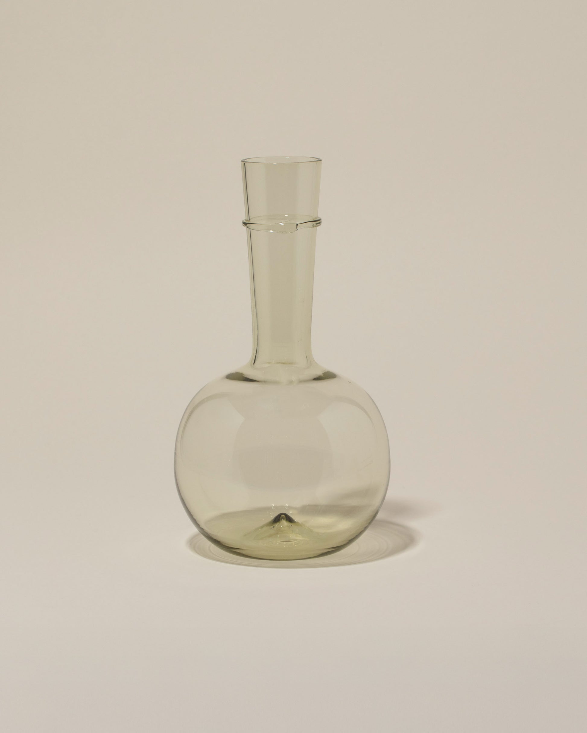 Bollenglass Design Green Bud Vase on light color background.