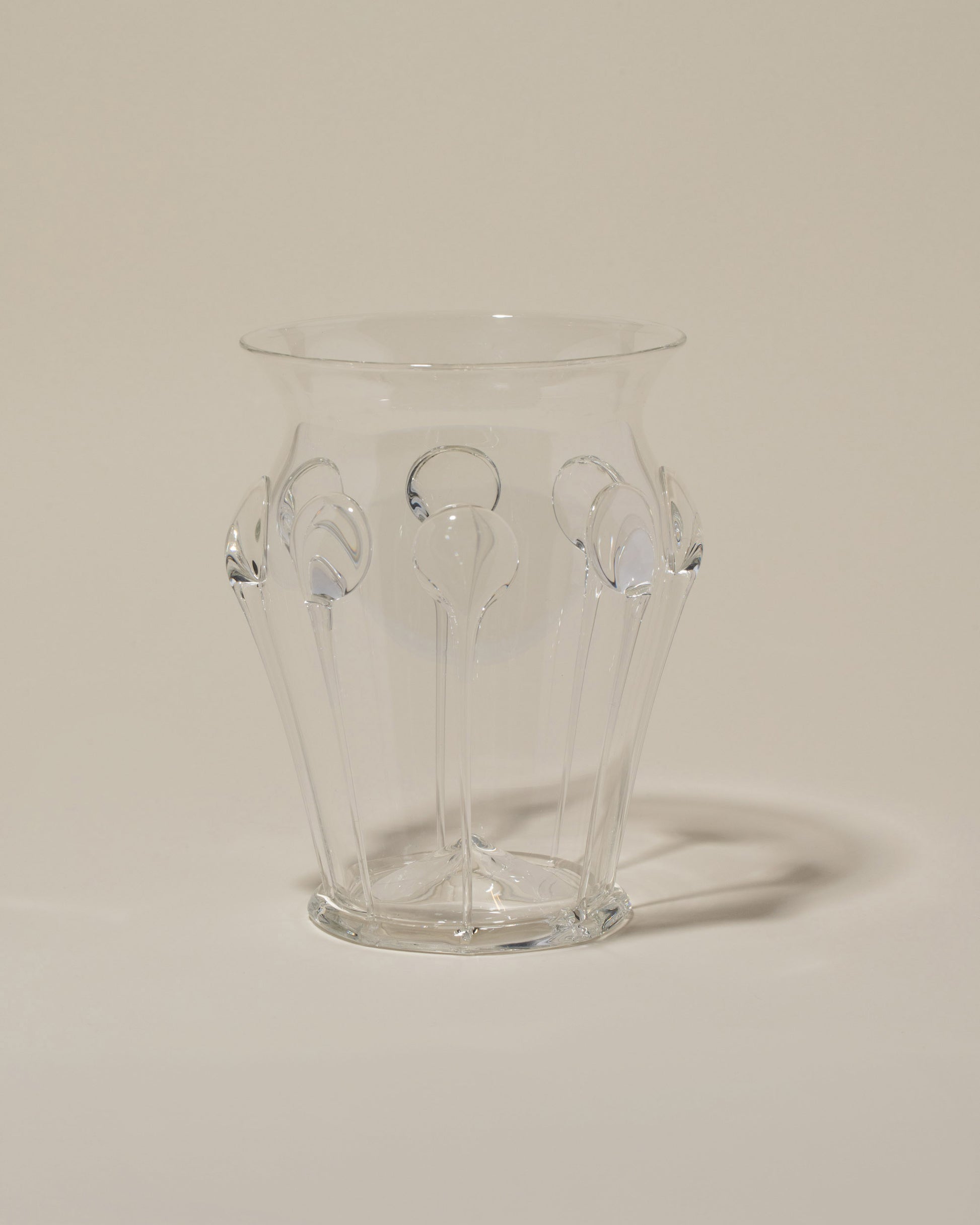 Bollenglass Design Clear Drip Vase on light color background.
