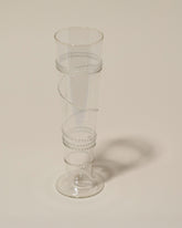 Closeup details of the Bollenglass Design Clear Small Spiral Vase on light color background.