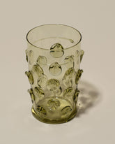 Closeup details of the Bollenglass Design Green Dot Beer Glass on light color background.